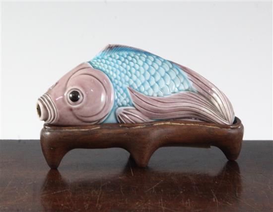A Chinese pale turquoise and aubergine glazed fish snuff bottle, 20th century, 8.8cm, wood stand